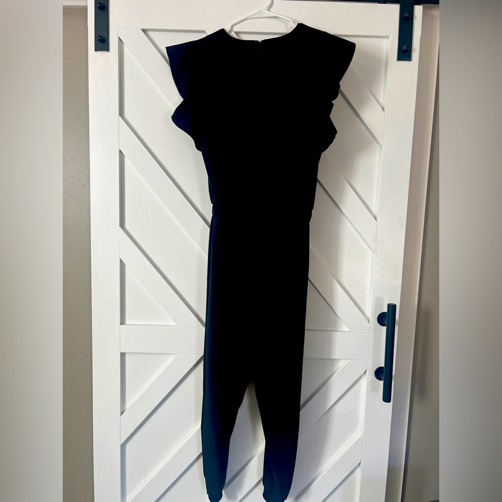 Albion romper with ruffle sleeve size small